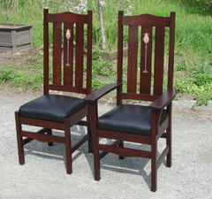 Arm chair and side chair shown together.
